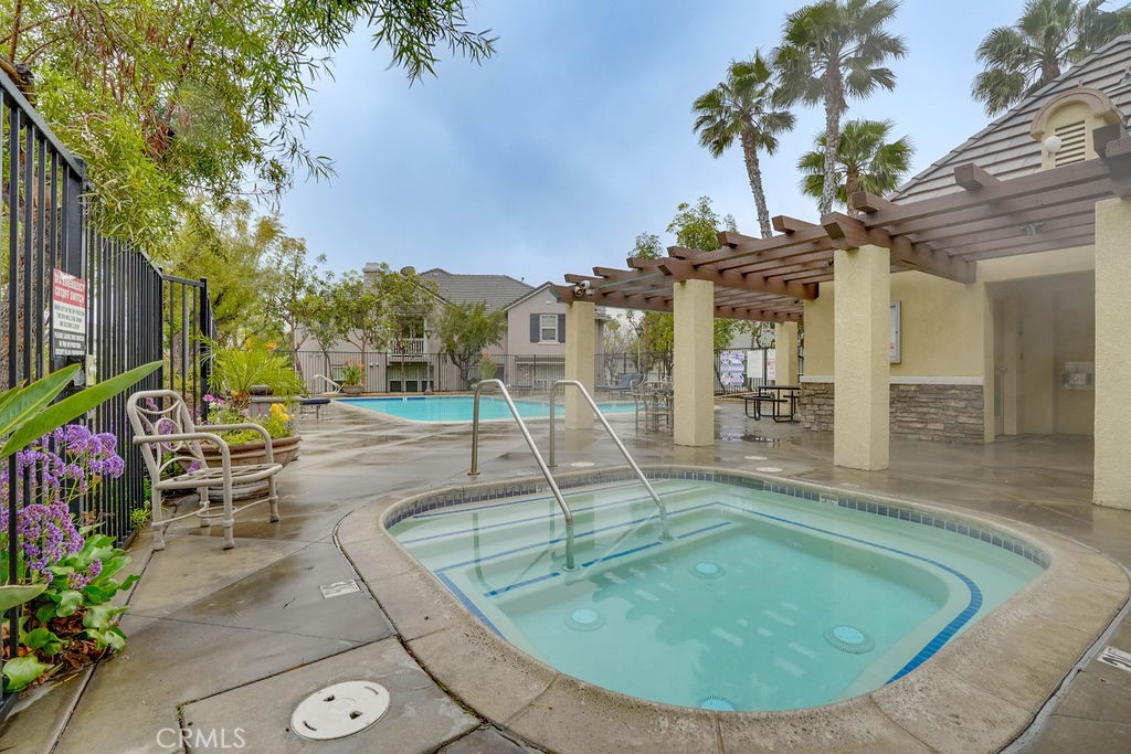 7701 Chambray Place, Unit 3 Rancho Cucamonga, CA 91739 - Photo 46 of 52 a view of a swimming pool with a patio