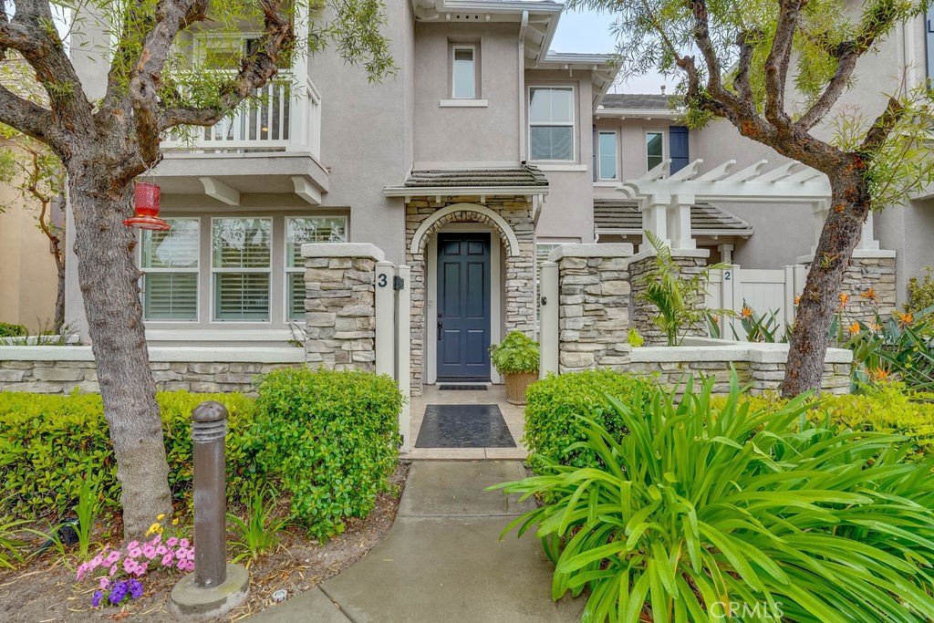 7701 Chambray Place, Unit 3 Rancho Cucamonga, CA 91739 - Photo 5 of 52 front view of a house with a garden