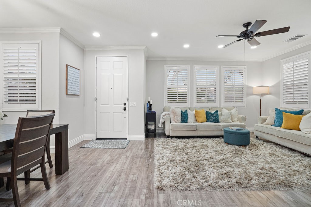 7701 Chambray Place, Unit 3 Rancho Cucamonga, CA 91739 - Photo 10 of 52 a living room with furniture and a window
