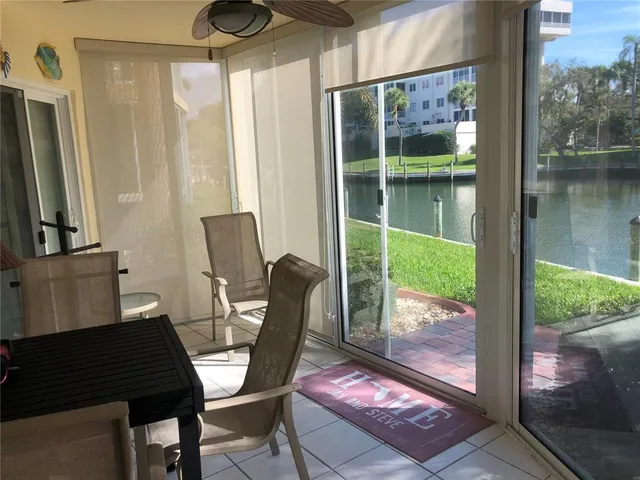 a view of a dining room with furniture and window