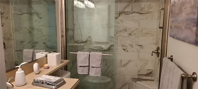a bathroom with a toilet and shower