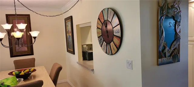 a view of a hallway with paintings on the wall