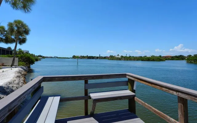 a view of a lake with houses in the back