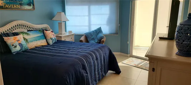 a bedroom with a bed and a fireplace