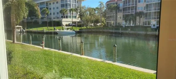 a lake with tall building in the background