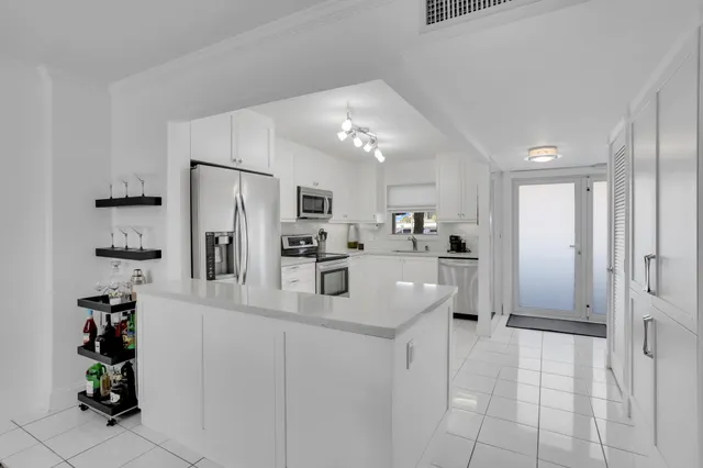 a dining room with a table and chairs