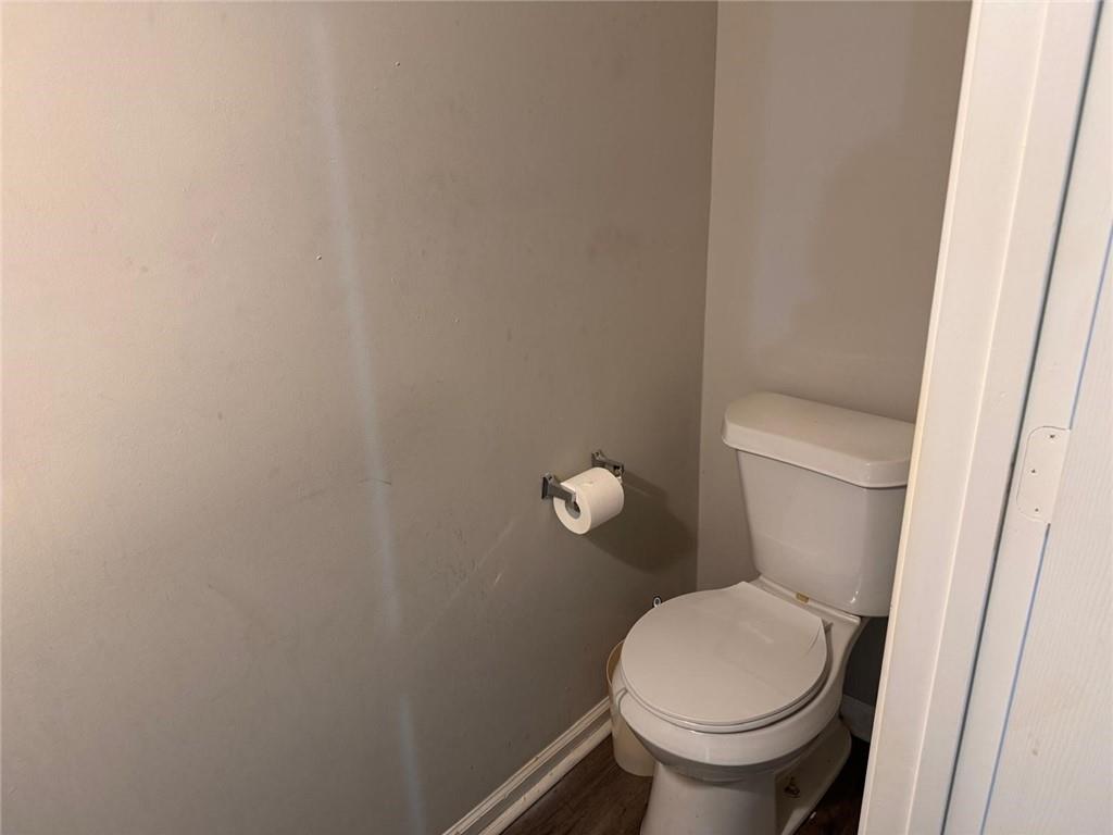 3833 Waldrop Lane Decatur, GA 30034 - Photo 13 of 20 a white toilet sitting next to a white cabinet