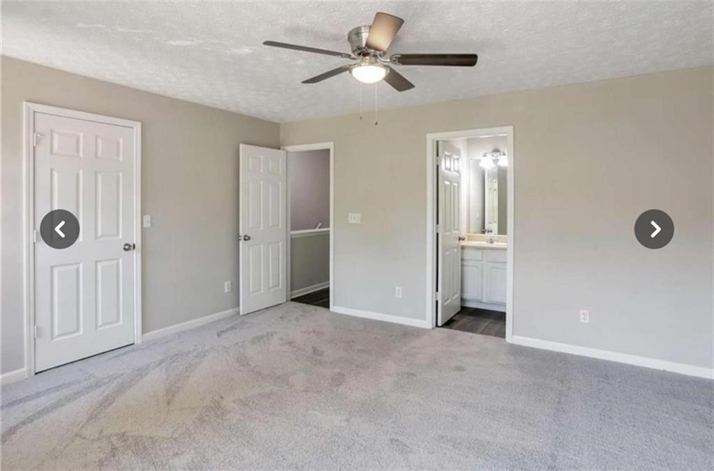 3833 Waldrop Lane Decatur, GA 30034 - Photo 16 of 20 an empty room with closet and a ceiling fan