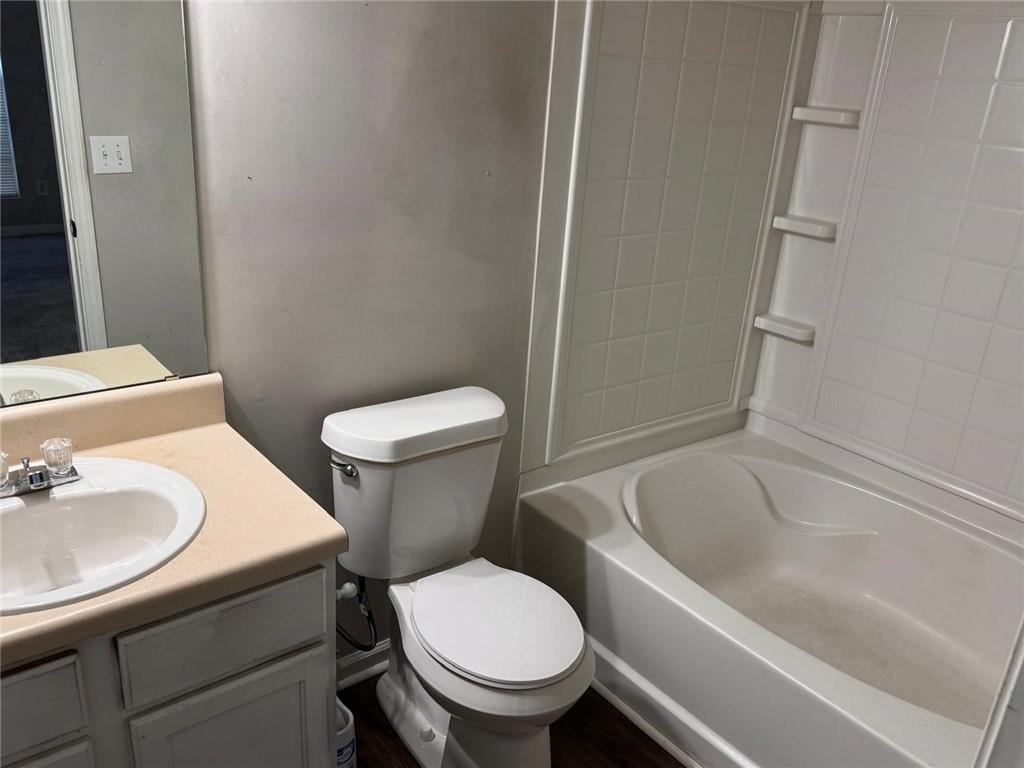 3833 Waldrop Lane Decatur, GA 30034 - Photo 18 of 20 a white toilet sitting next to a bathroom sink and tub