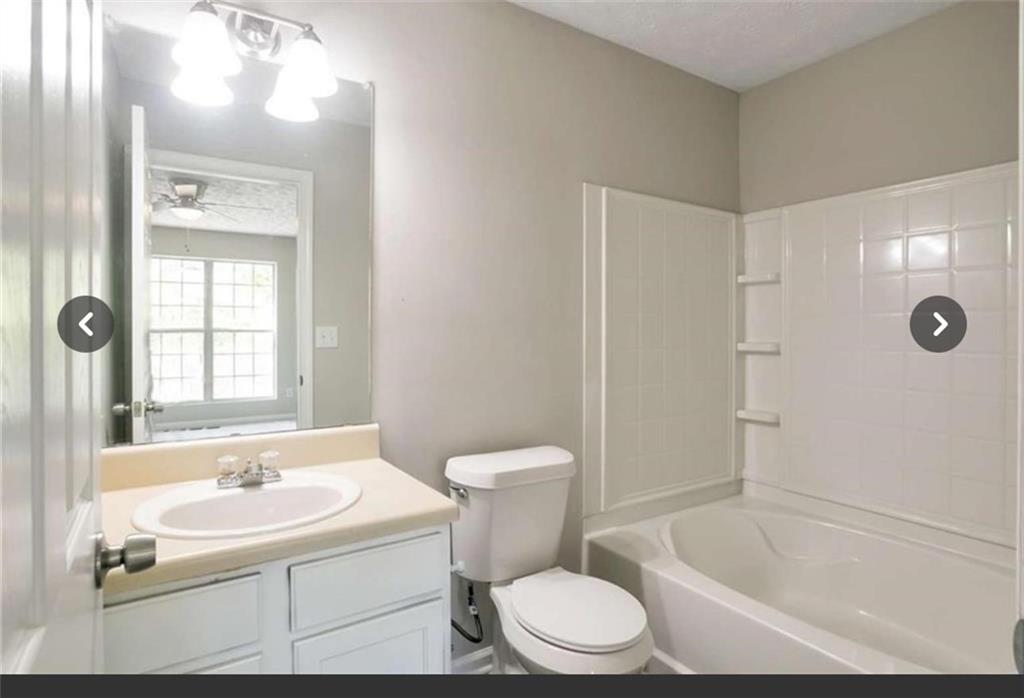 3833 Waldrop Lane Decatur, GA 30034 - Photo 19 of 20 a bathroom with a sink a toilet and shower
