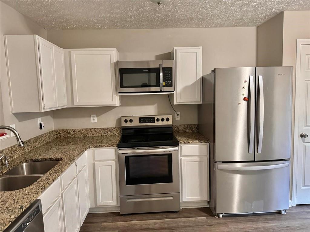 3833 Waldrop Lane Decatur, GA 30034 - Photo 9 of 20 a kitchen with a refrigerator stove and microwave