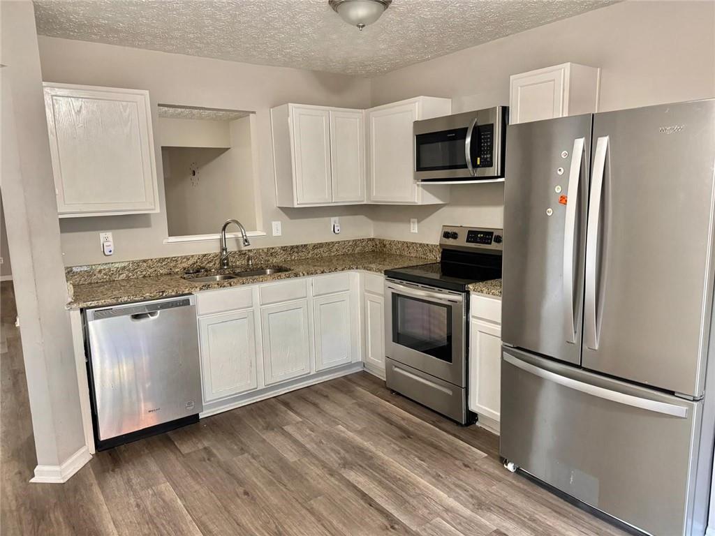 3833 Waldrop Lane Decatur, GA 30034 - Photo 10 of 20 a kitchen with a sink stove and refrigerator