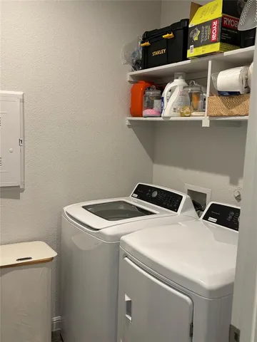 a utility room with dryer and washer