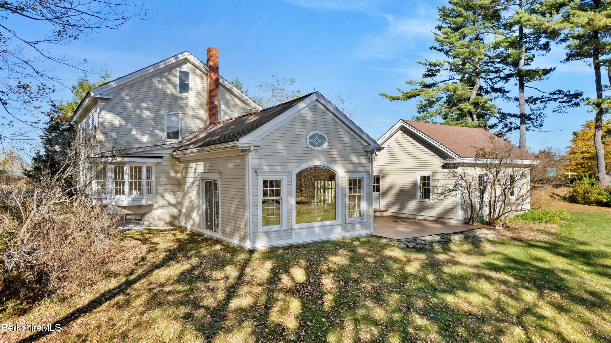 191 Sandisfield Road Sandisfield, MA 01255 - Photo 3 of 42 a front view of a house with a garden