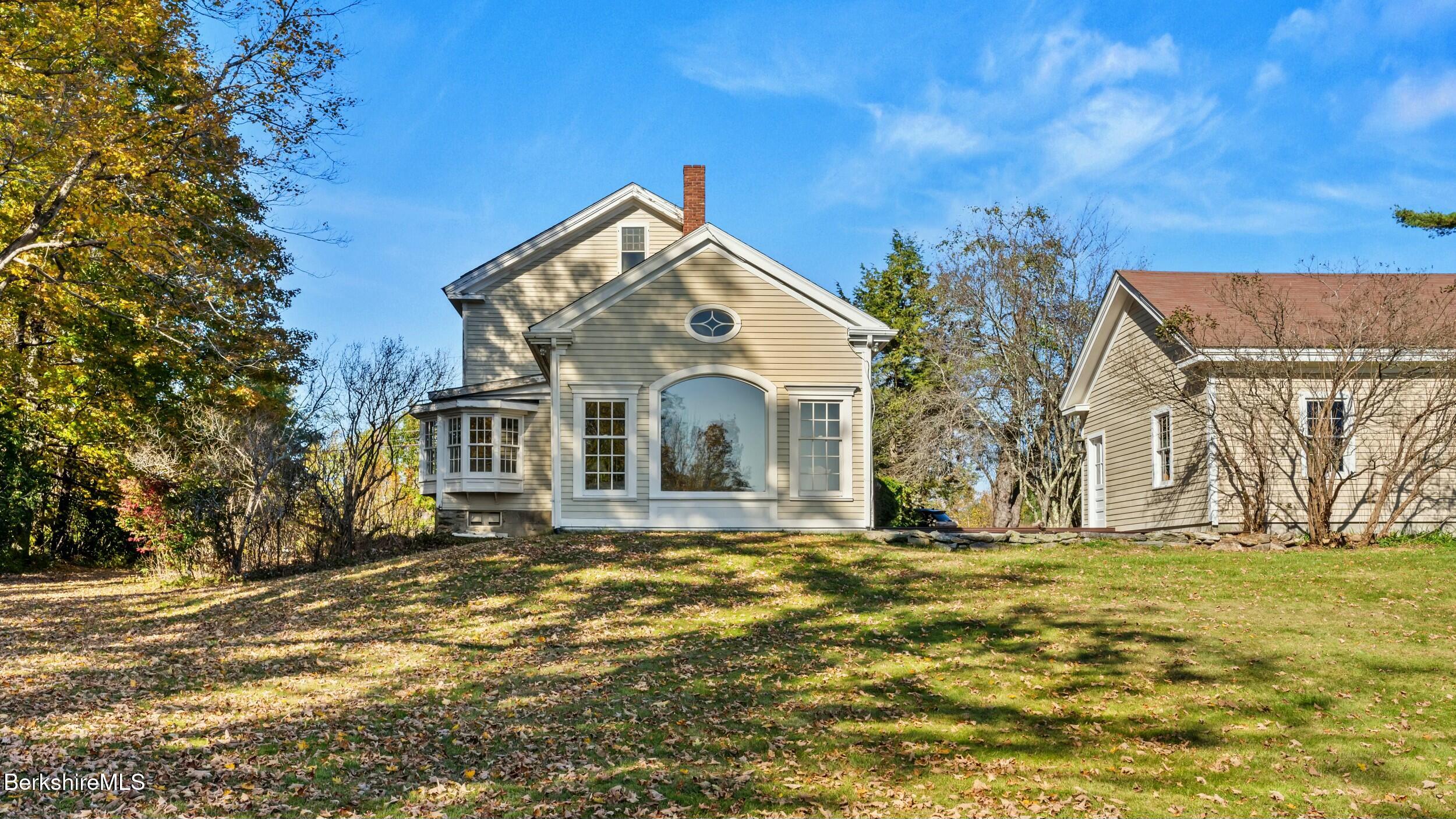 191 Sandisfield Road Sandisfield, MA 01255 - Photo 39 of 42 a front view of a house with a yard