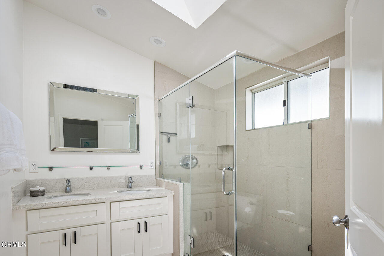 1260 Riviera Drive Pasadena, CA 91107 - Photo 11 of 28 a bathroom with a double vanity sink mirror and shower