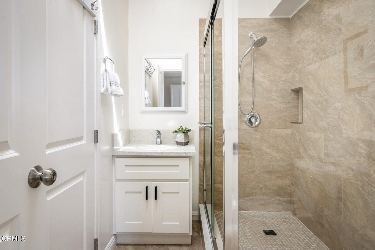 1260 Riviera Drive Pasadena, CA 91107 - Photo 14 of 28 a bathroom with a shower a sink and a mirror