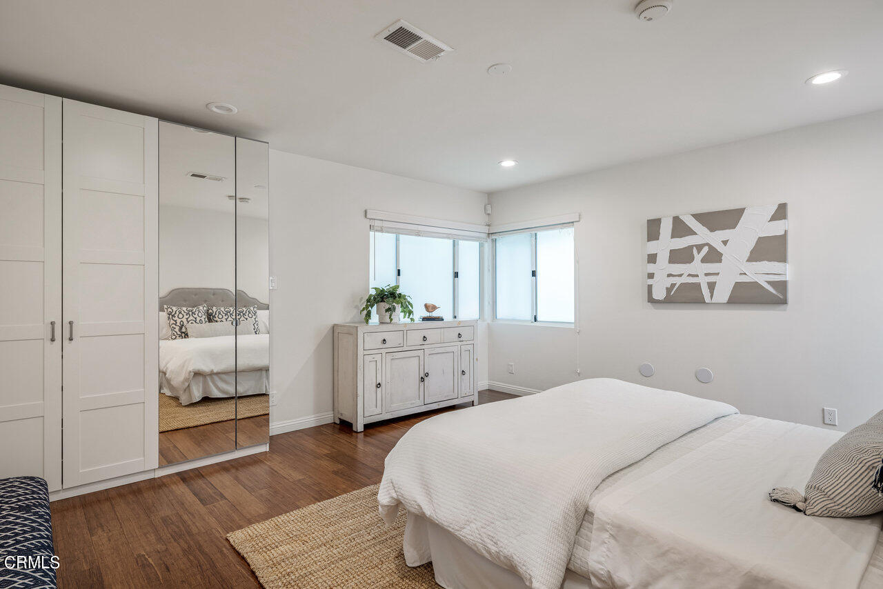 1260 Riviera Drive Pasadena, CA 91107 - Photo 16 of 28 a bedroom with a bed and wooden floor