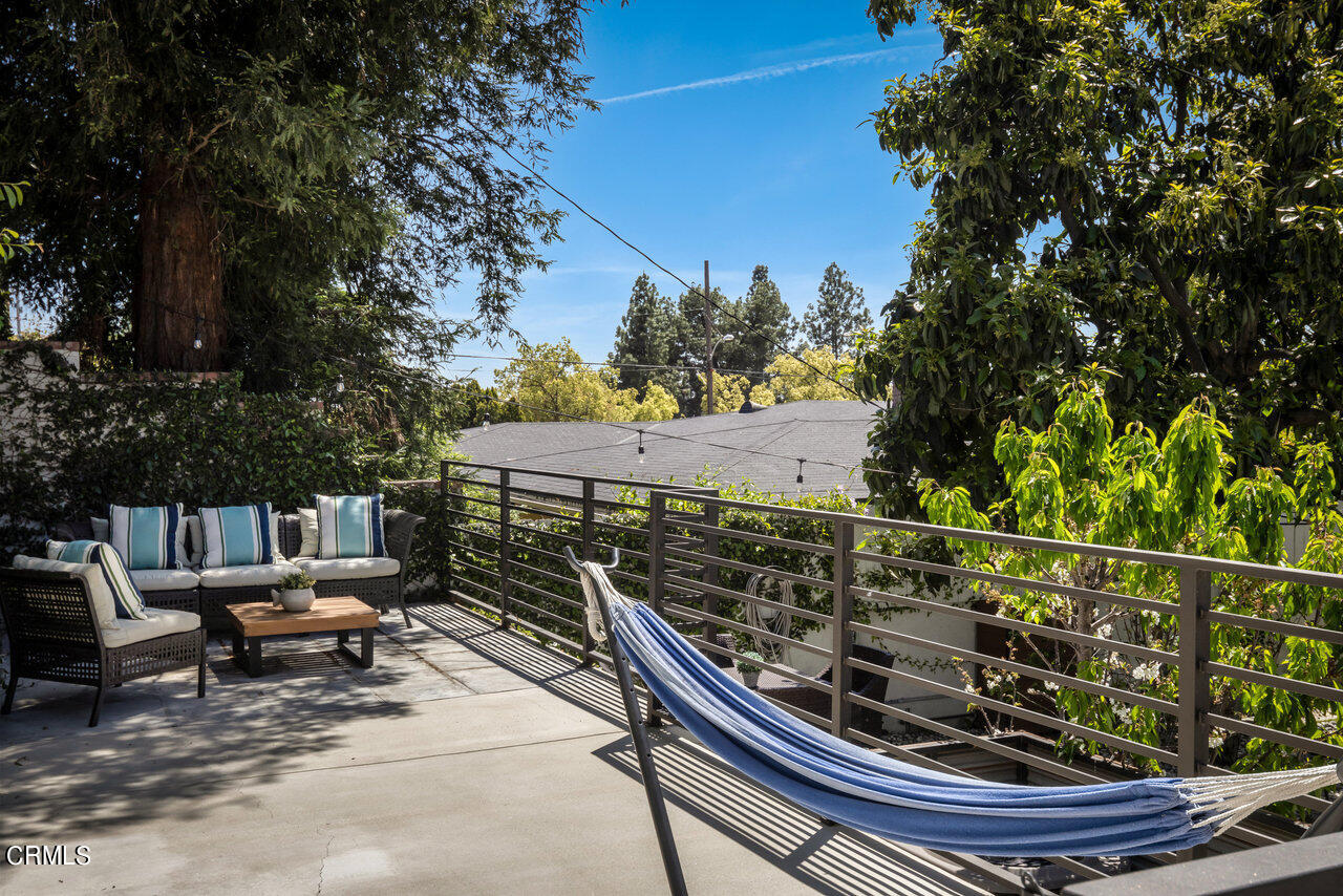 1260 Riviera Drive Pasadena, CA 91107 - Photo 22 of 28 a view of a roof deck with wooden fence and trees