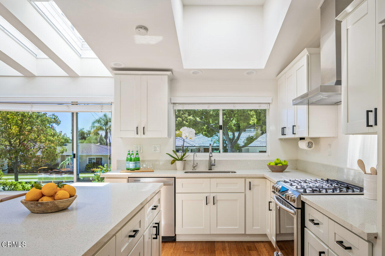 1260 Riviera Drive Pasadena, CA 91107 - Photo 5 of 28 a kitchen with a sink stove and cabinets