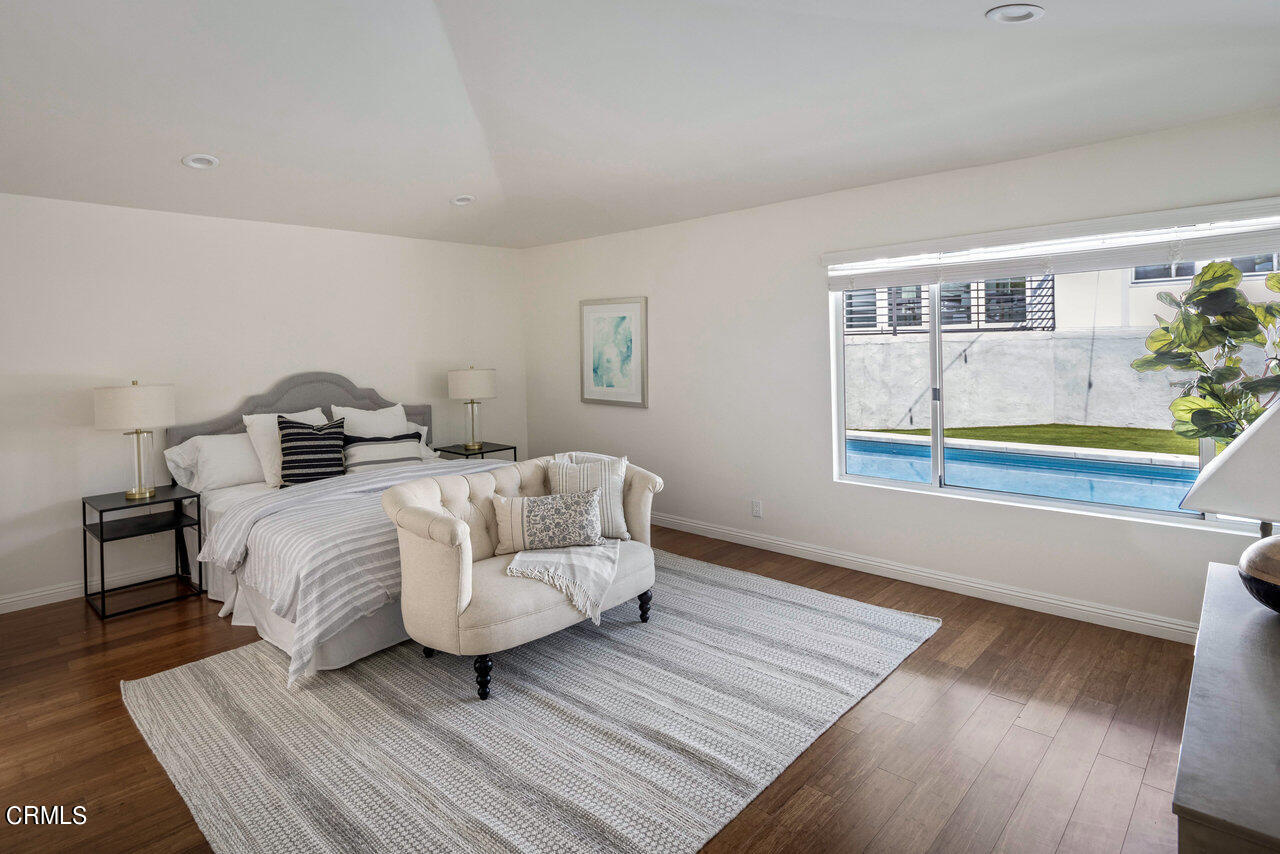 1260 Riviera Drive Pasadena, CA 91107 - Photo 9 of 28 a bedroom with a bed and wooden floor