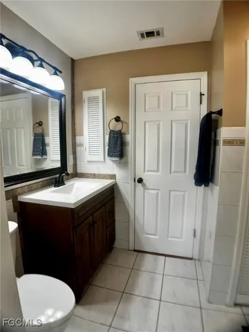 a bathroom with a sink a mirror and a shower