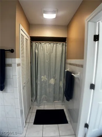 a utility room with sink dryer and washer