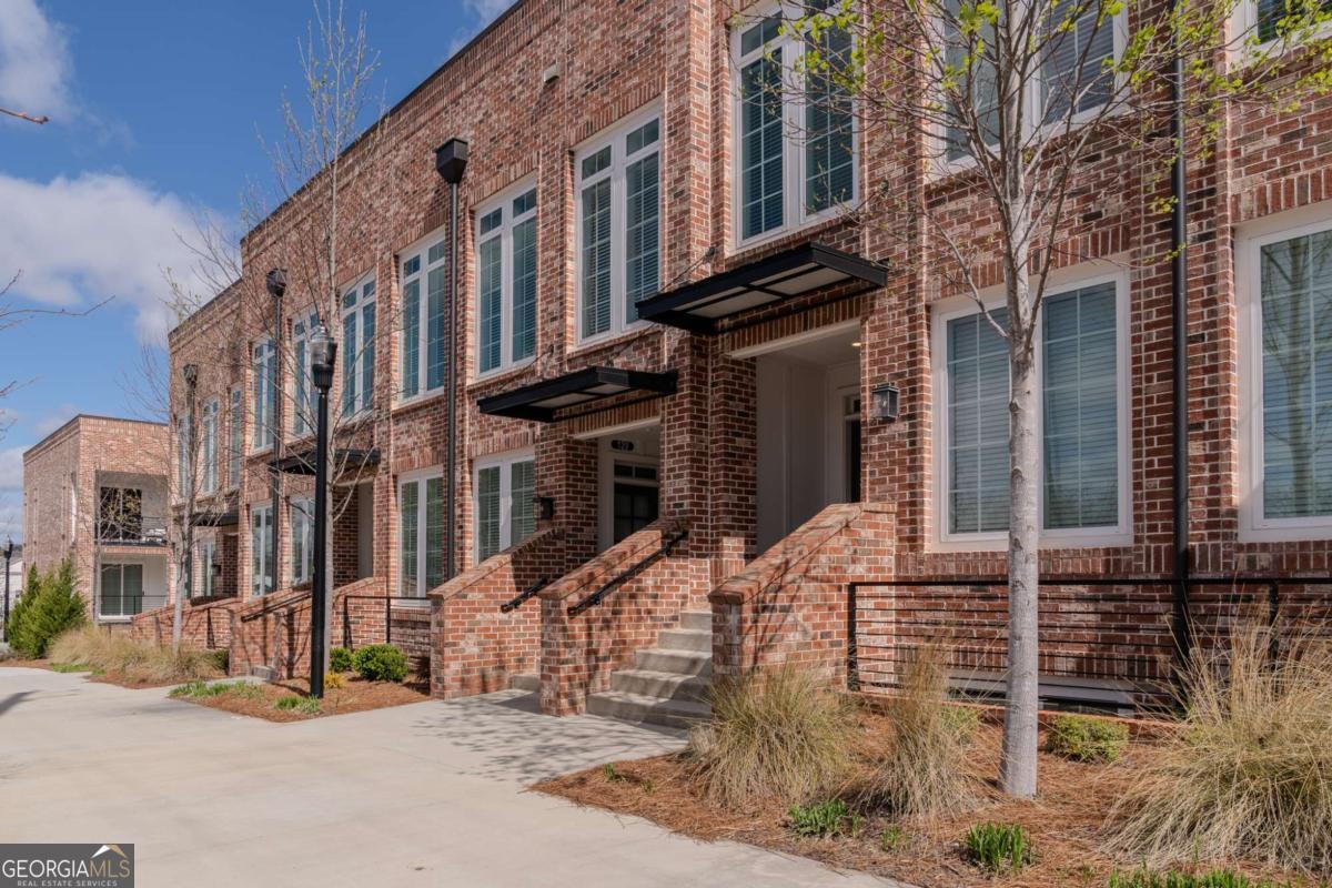 a view of a building with a street
