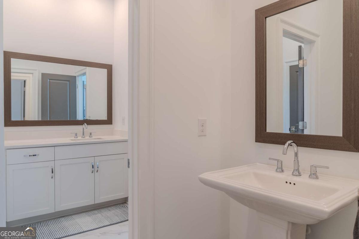 133 Devore Road, Unit 208 Alpharetta, GA 30009 - Photo 12 of 20 a bathroom with a sink and a mirror
