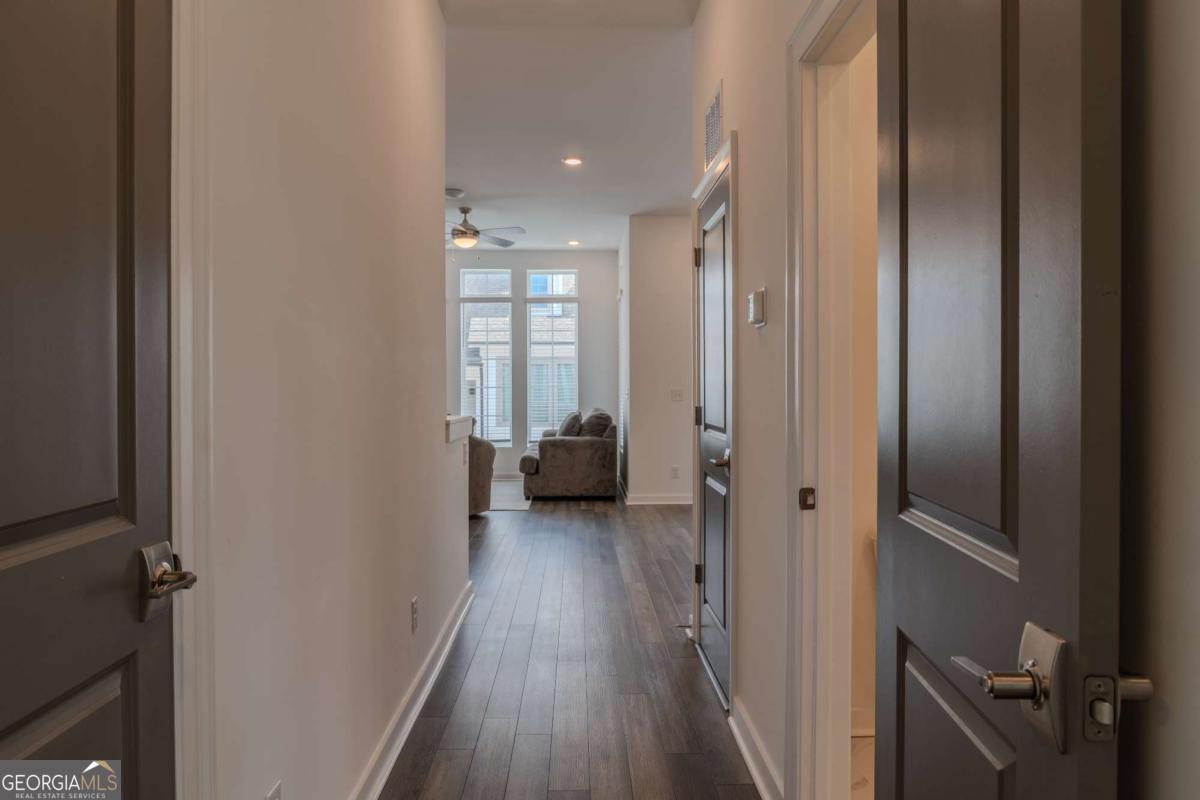 133 Devore Road, Unit 208 Alpharetta, GA 30009 - Photo 16 of 20 a view of a hallway with a hardwood floor