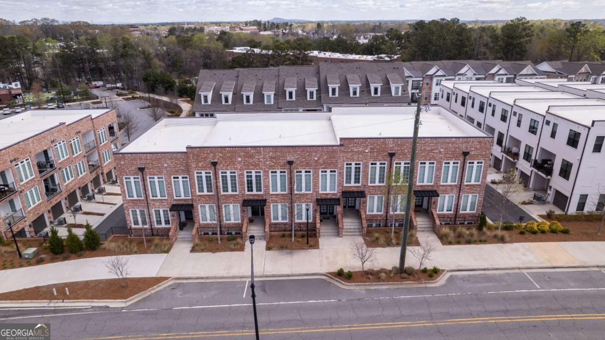 133 Devore Road, Unit 208 Alpharetta, GA 30009 - Photo 19 of 20 a view of a brick building with a yard