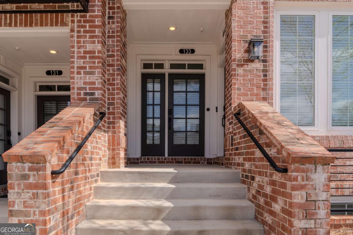 133 Devore Road, Unit 208 Alpharetta, GA 30009 - Photo 2 of 20 a view of entryway with a front door