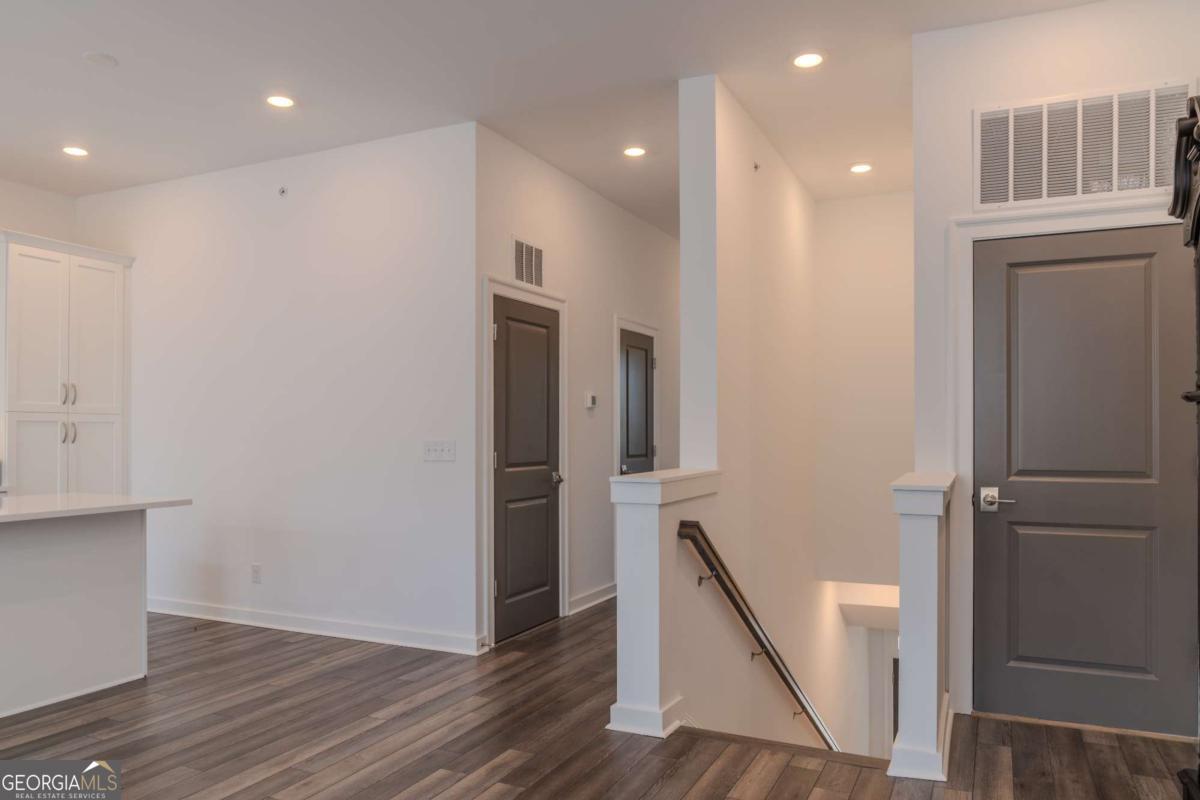 133 Devore Road, Unit 208 Alpharetta, GA 30009 - Photo 8 of 20 a view of entryway with wooden floor
