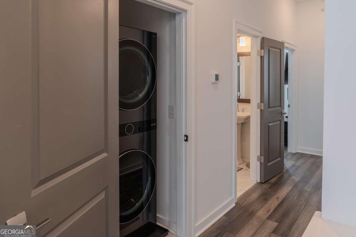 133 Devore Road, Unit 208 Alpharetta, GA 30009 - Photo 9 of 20 a close view of walk in closet