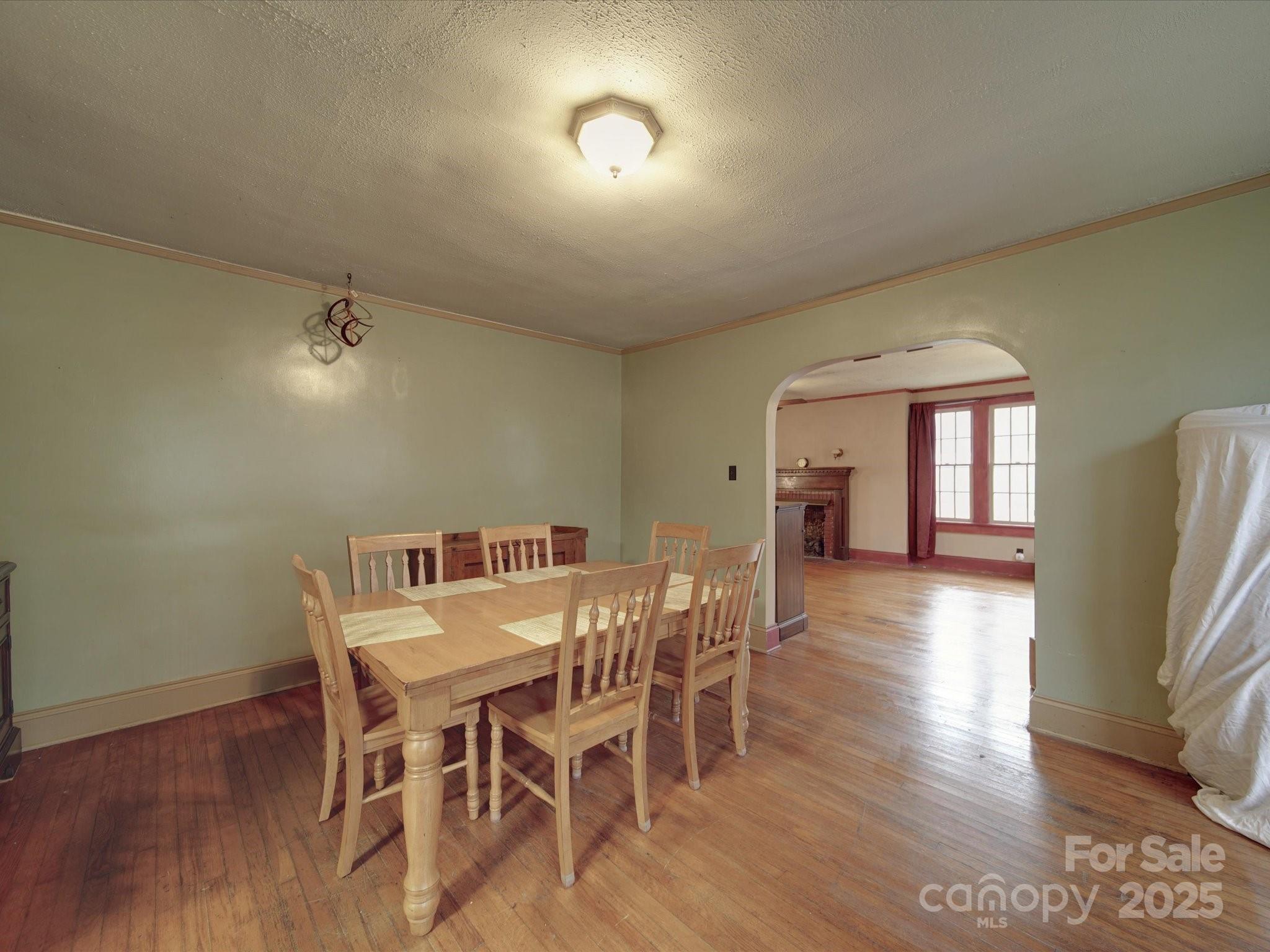 1231 Cherry Hill Road Mocksville, NC 27028 - Photo 8 of 31 a view of a dining room with furniture and wooden floor