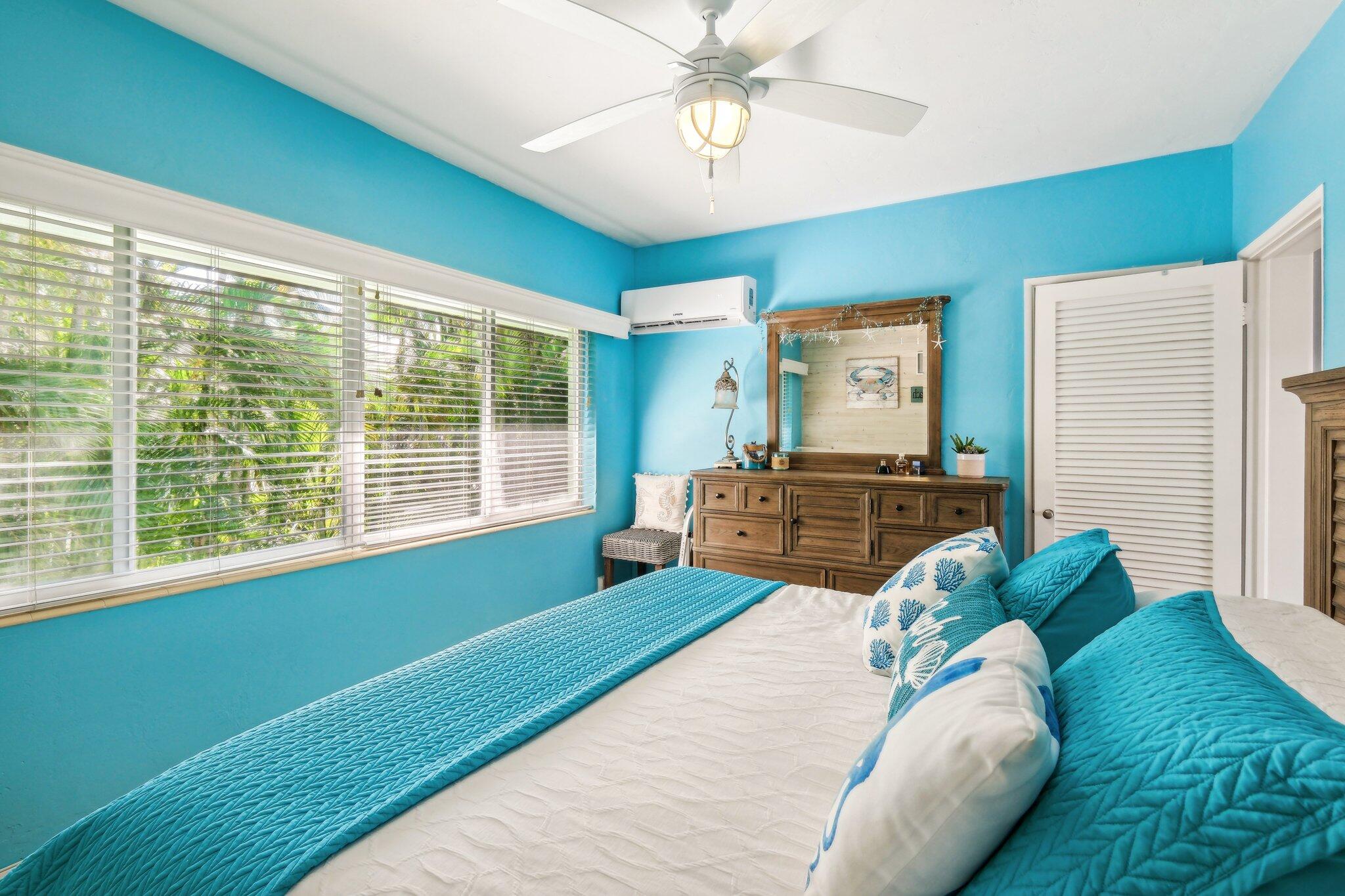 1006 Casuarina Road, Unit 11 Delray Beach, FL 33483 - Photo 14 of 19 a bed sitting in a bedroom next to a window