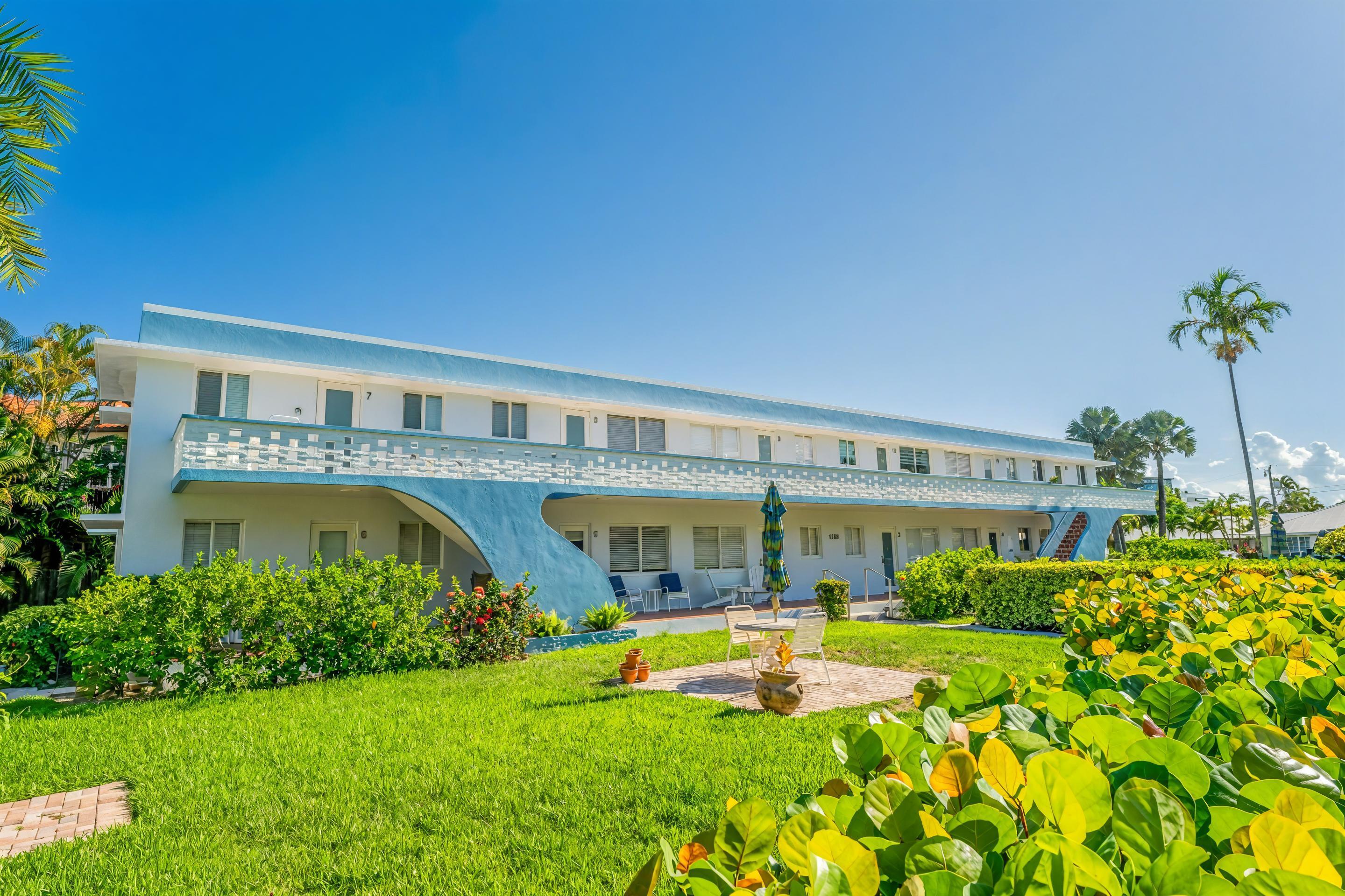 1006 Casuarina Road, Unit 11 Delray Beach, FL 33483 - Photo 2 of 19 a view of swimming pool with garden