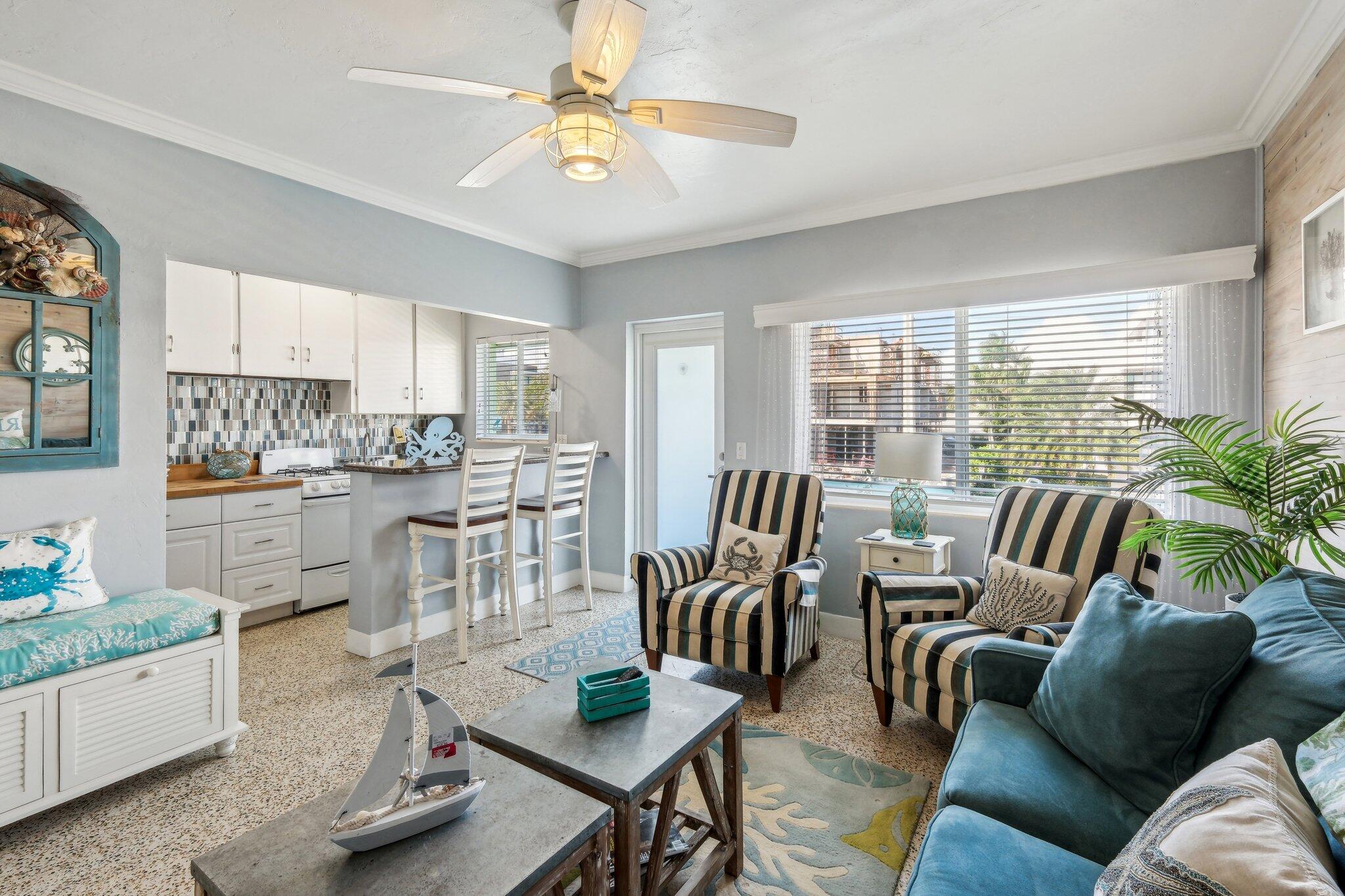 1006 Casuarina Road, Unit 11 Delray Beach, FL 33483 - Photo 7 of 19 a living room with furniture and kitchen view