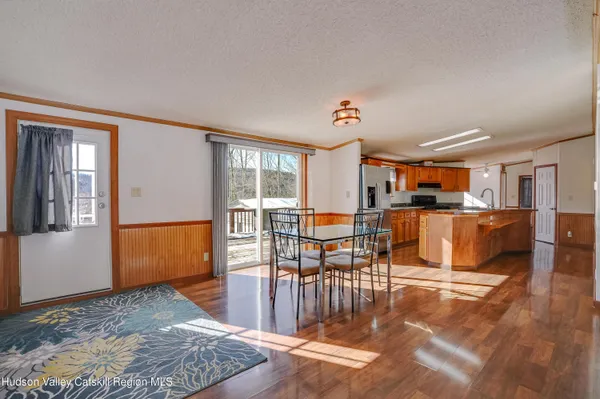 a living room with lots of furniture and a rug