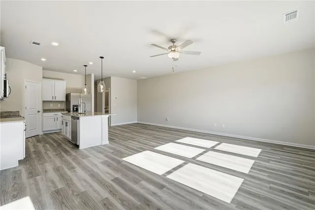 a view of kitchen with furniture and wooden floor