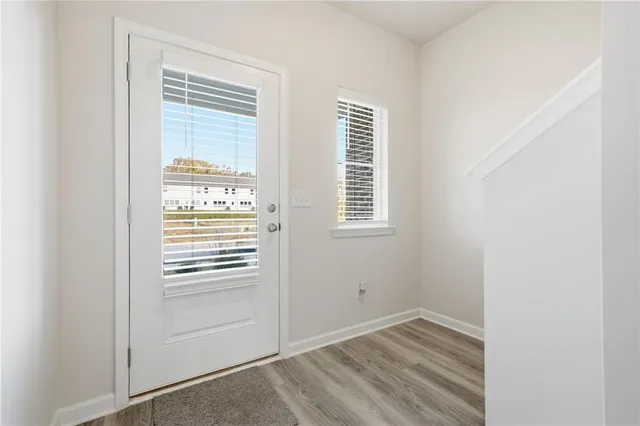 a view of empty room with windows
