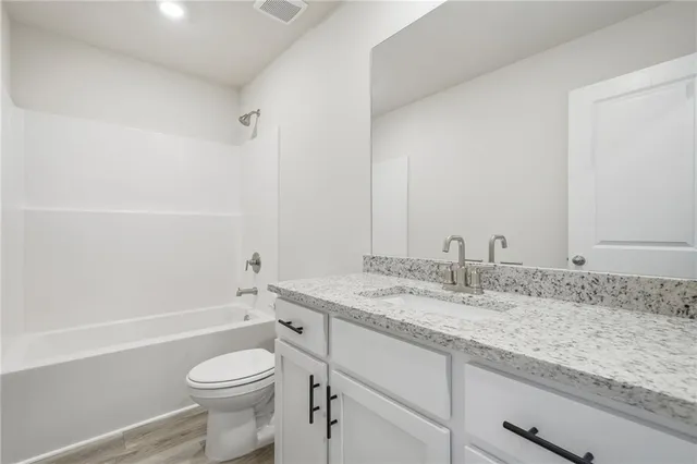 a balcony with table and chairs