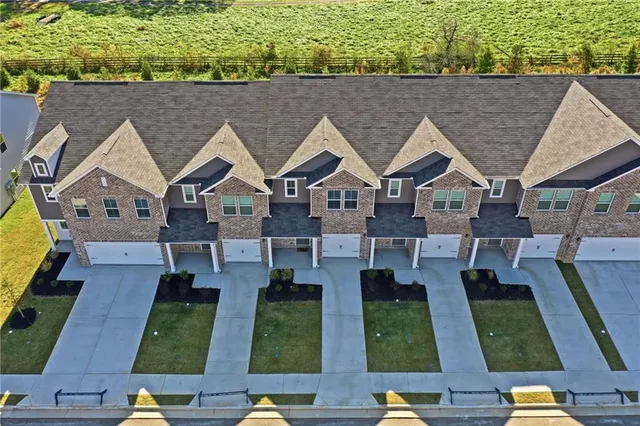 an aerial view of a house with a big yard