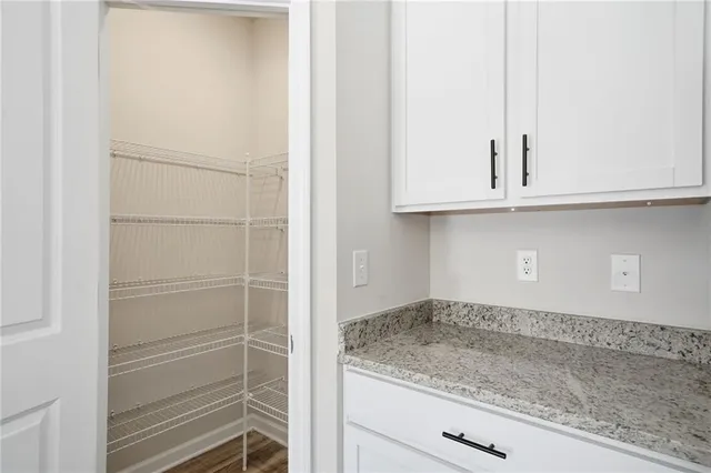 a kitchen with a white cabinets and a white stove