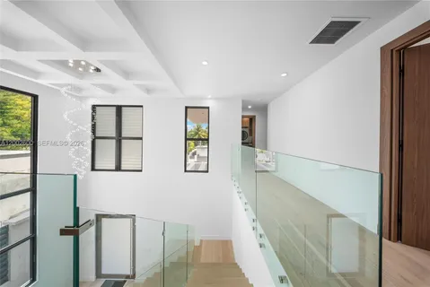 a view of a balcony with wooden floor