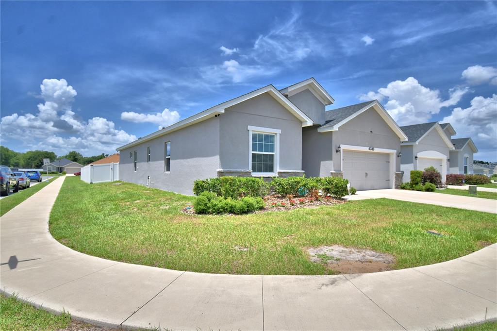 4340 Reding Way Lakeland, FL 33813 - Photo 3 of 63 a view of a house with a yard