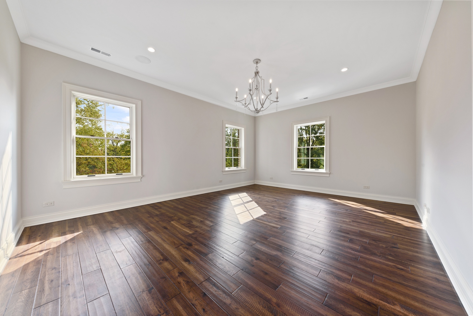 820 Country Club Road Crystal Lake, IL 60014 - Photo 18 of 48 a view of an empty room with wooden floor and a window