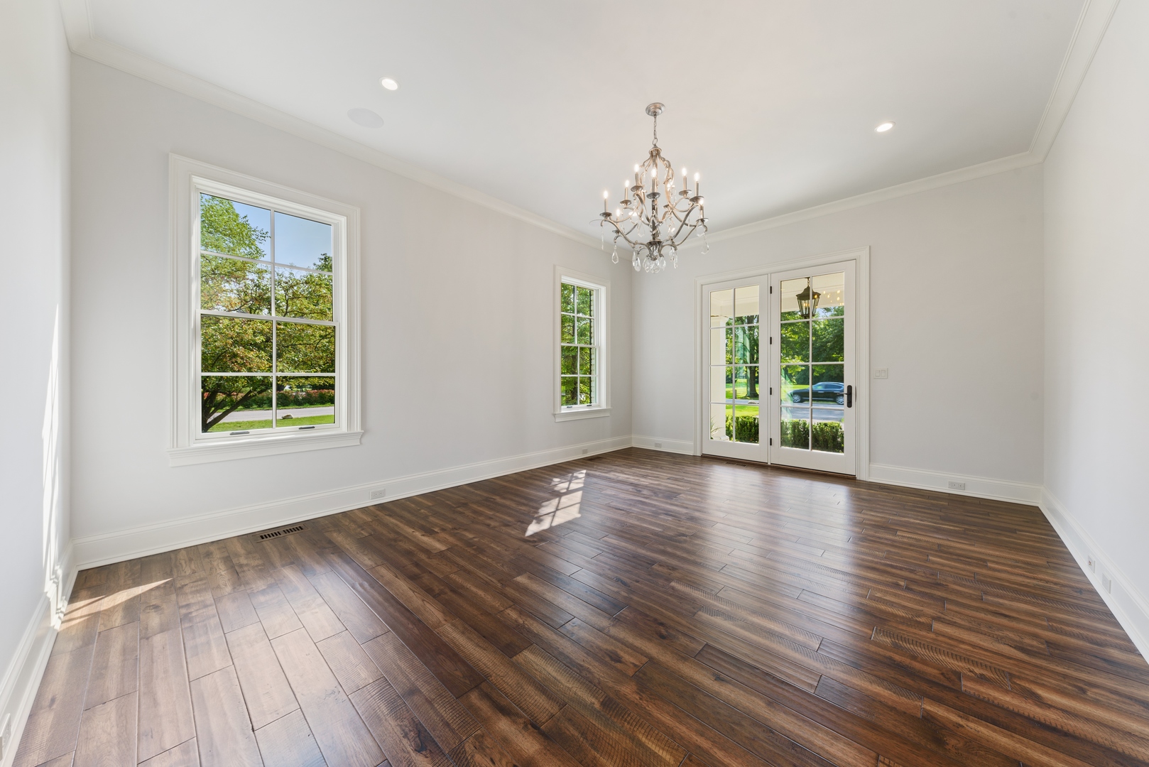 820 Country Club Road Crystal Lake, IL 60014 - Photo 23 of 48 a view of an empty room with wooden floor and a window