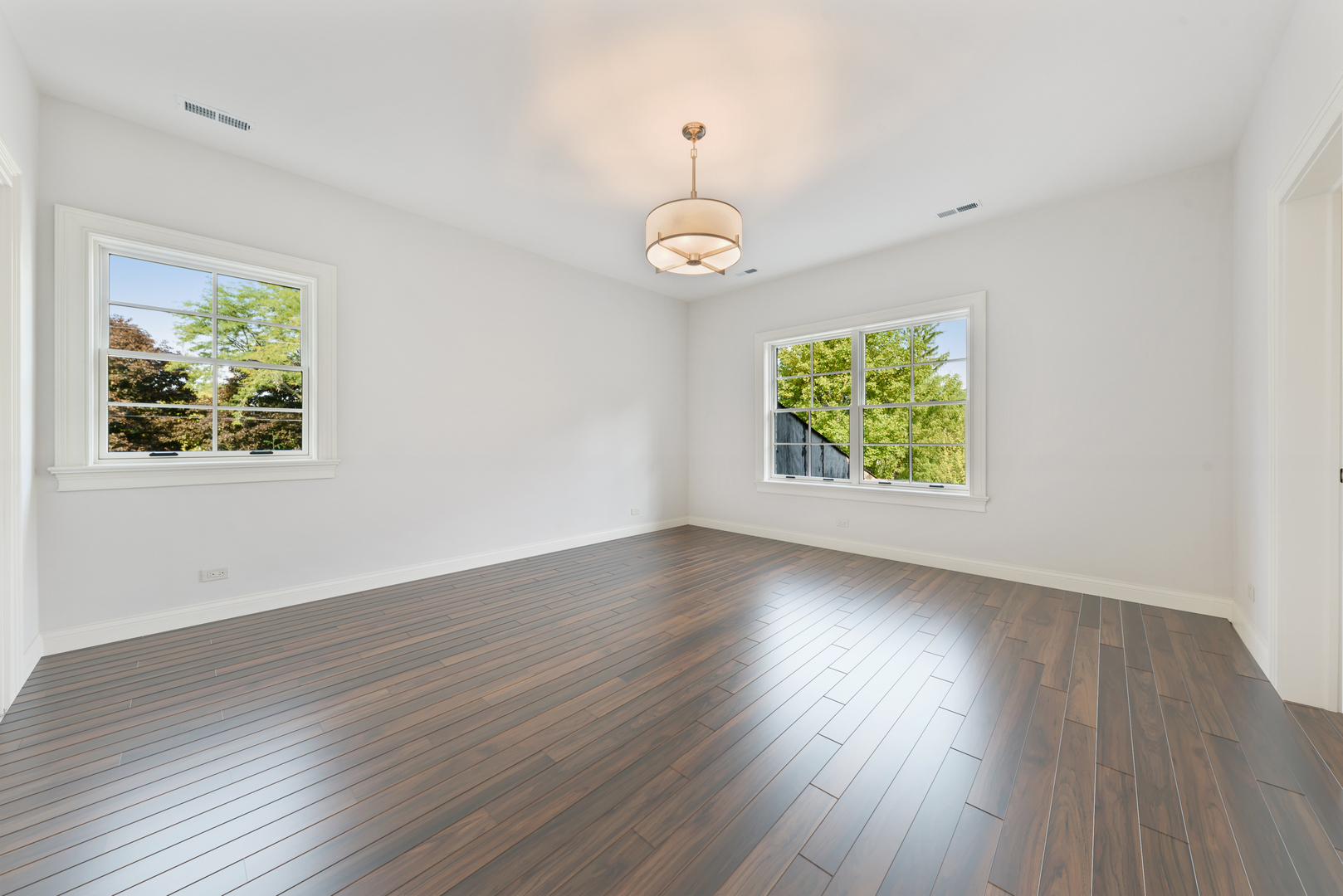 820 Country Club Road Crystal Lake, IL 60014 - Photo 27 of 48 a view of an empty room with wooden floor and a window