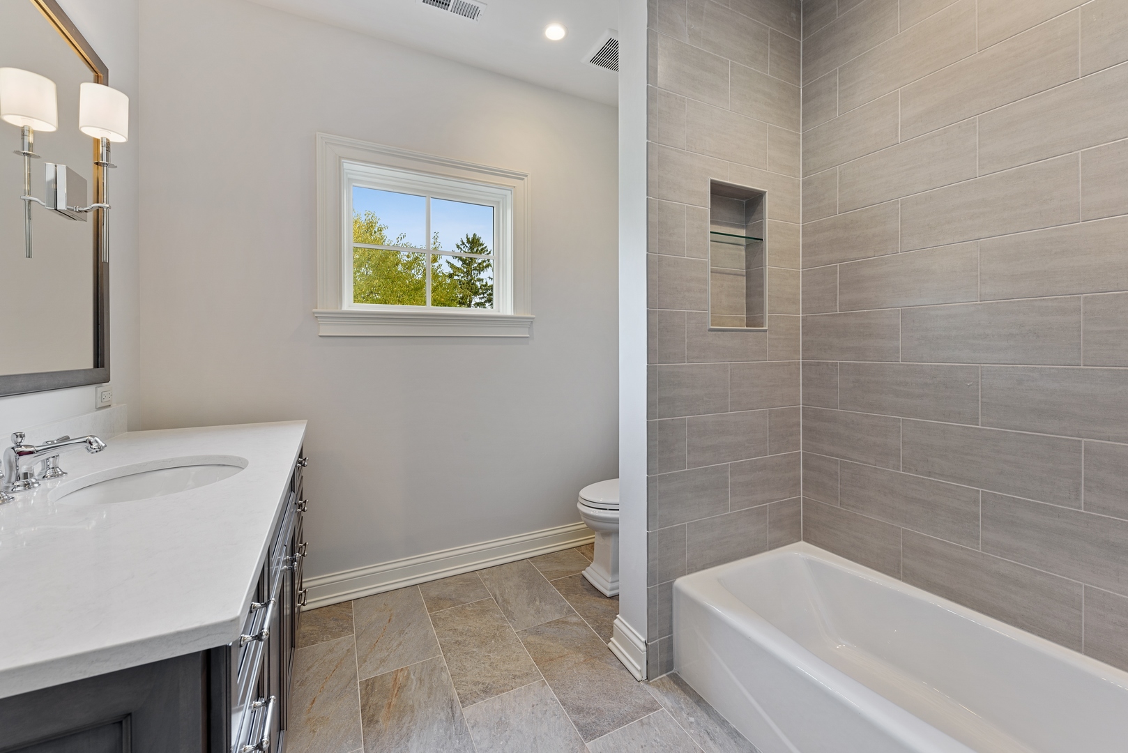 820 Country Club Road Crystal Lake, IL 60014 - Photo 28 of 48 a bathroom with a granite countertop bathtub sink and toilet